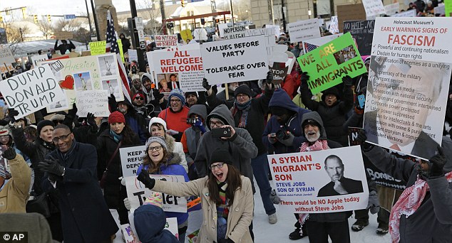 People protest in a demonstration in Cleveland. The demonstration was organized in protest of President Donald Trump's immigration order