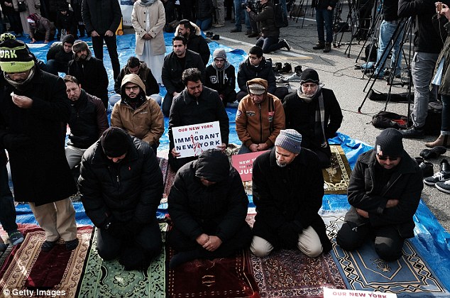 Muslim men pray at a prayer and demonstration at JFK airport to protest President Donald Trump's Executive Order banning immigrants and refugees from seven Muslim-majority countries on February 3, 2017 in New York City