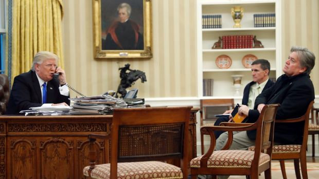 President Donald Trump with Mike Flynn (centre) and Steve Bannon (right) in the Oval Office during the call to Prime ...