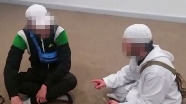 One of the boys, in white, uploaded videos of him converting other young people to Islam.