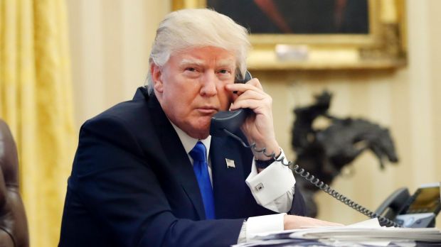 US President Donald Trump speaks on the phone with Prime Minister Malcolm Turnbull in the Oval Office of the White House.