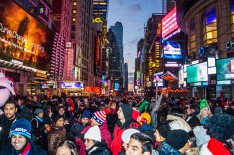 New York, NY, USA - December 31, 2014: Crowds of people gathering in Times Square hours before midnight on New Years ...