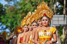 Denpasar, Bali Island, Indonesia - June 11, 2016: Group of Balinese people. Beautiful dancer women in traditional ...