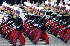 PARIS, FRANCE - JULY 14: Military parades march past members of the government at the ceremony of Bastille Day on the ...