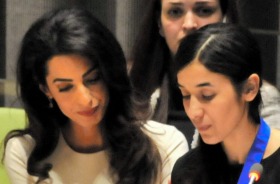 Yazidi woman and suvivor of the Islamic State's brutality, Nadia Murad Basee Taha speaks while attorney Amal Clooney ...