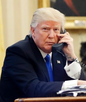 US President Donald Trump speaks on the phone with Prime Minister Malcolm Turnbull in the Oval Office of the White House.