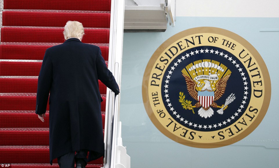 President Donald Trump walks up the steps of Air Force One at Andrews Air Force Base, Md