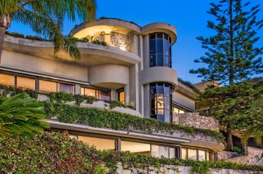 Car dealer Neville Crichton swaps $60 million Sydney mansion for a $33 million ‘mini-me’ up the road