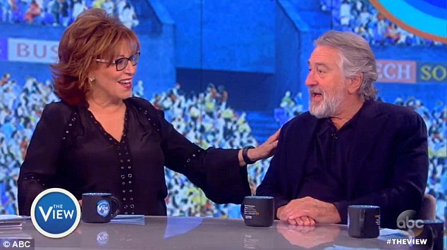 The legendary actor was asked by host Joy Behar (left) about his threat of violence towards then-candidate Trump in October. De Niro told her that he still wants to 'punch him in the face'