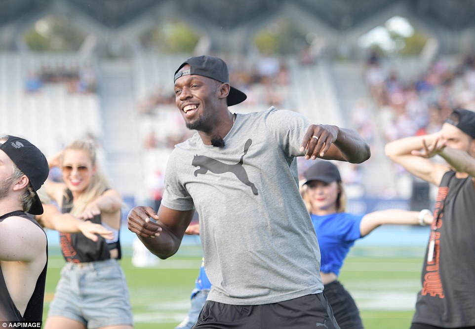 Jamaican sprinter Usain Bolt runs onto the field at the start of the Nitro Athletics