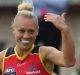 Erin Phillips of the Crows (second from right) celebrates a goal.