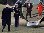 US President Donald Trump and wife Melania make their way across the tarmac to greet well-wishers upon arrival at Palm Beach International Airport in West Palm Beach