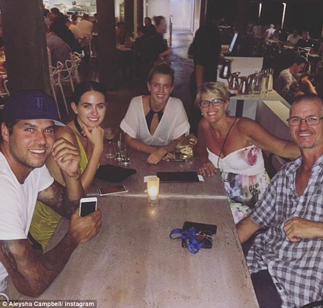 Close family: Aleysha (top) and Jesinta (pictured left with husband Lance Franklin) say they remember dressing each other up in fairy costumes, a far cry from their lives today