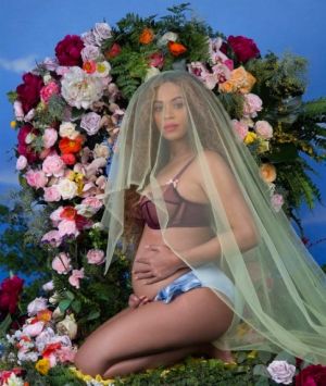 Beyonce shows off her baby bump in an Instagram post announcing her pregnancy.