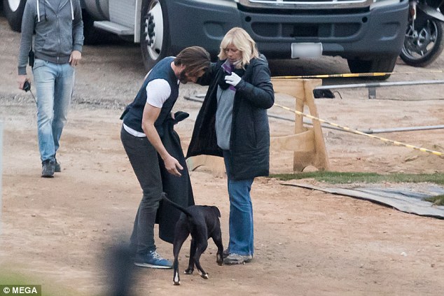 Man's best friend: Her co-star Chris Pine was also seen on set; the 36-year-old was throwing a ball for his dog during a break in filming