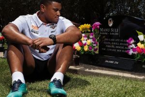 SYDNEY, AUSTRALIA - JANUARY 28: Wests Tigers player Moses Suli visiting his fathers grave at Rookwood Cemetary on ...