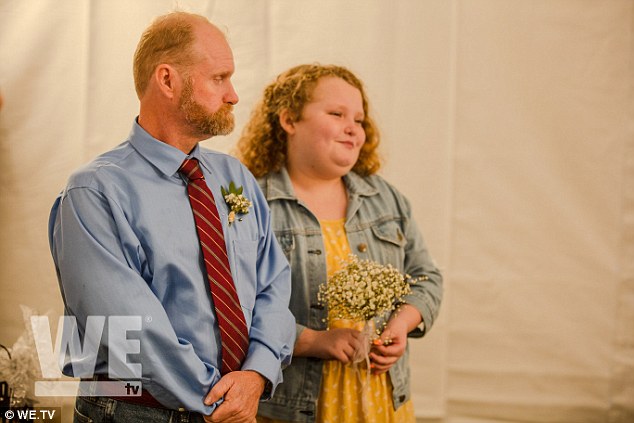 His best girl: Playing the bridesmaid was Honey Boo Boo, who looked cute in a yellow dress and denim jacket while carrying a bouquet of baby's breath flowers