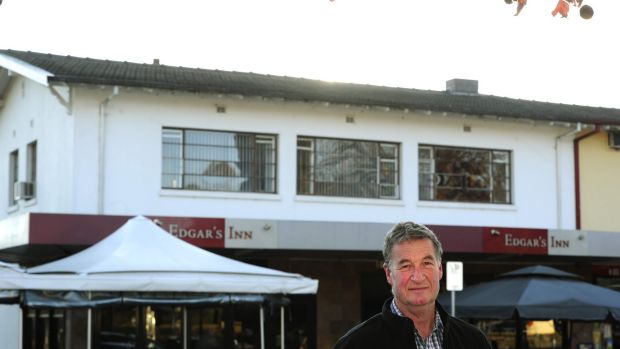 Jeff Darwin in 2015 outside his Ainslie shops building. The rood space in the flat above Edgar's Inn contains loose-fill ...