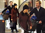 Pippa styled herself in a maroon coat and beanie whilst James was left to push her vintage bicycle
