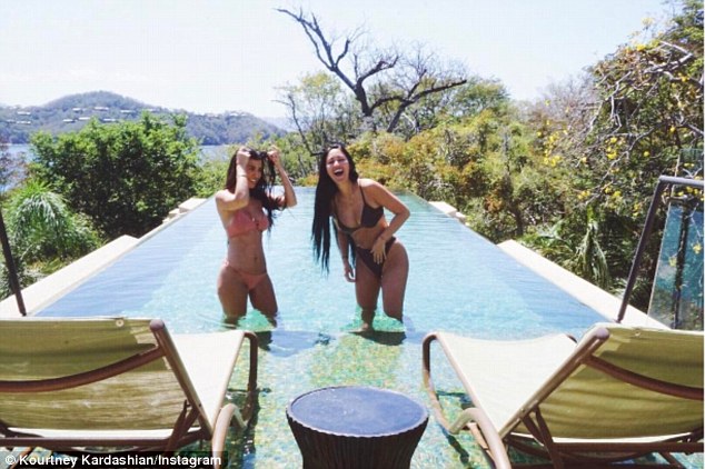 Wow: Kourtney shared a picture from their pool day to her Instagram account on Tuesday, captioning it: 'Honeymoon'