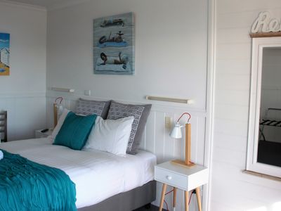 Queen size Bedroom has TV and ocean views