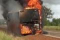 The school bus engulfed in flames.