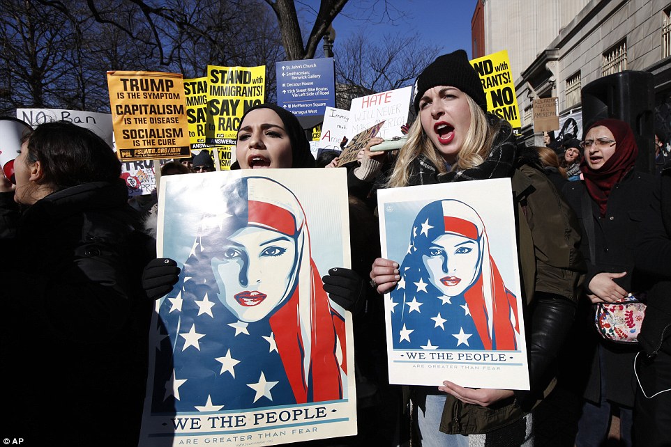 People marched near the White House to protest Trump's executive orders in Washington. D.C.