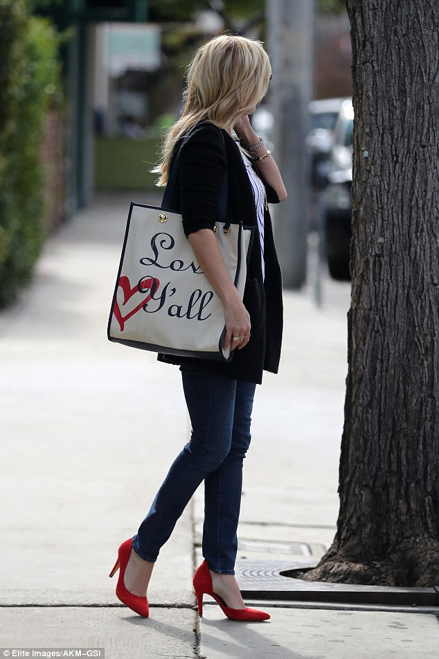 Spreading the message: Reese's tote, reading 'Love Y'all,' is part of her fashion line Draper James 