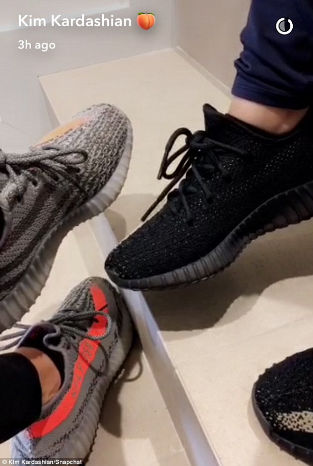 On the wrong foot: The social media sensation showed off her Yeezys as she and a friend waited for their trainer to arrive. In the snap, Kim has some angry words for her sisters