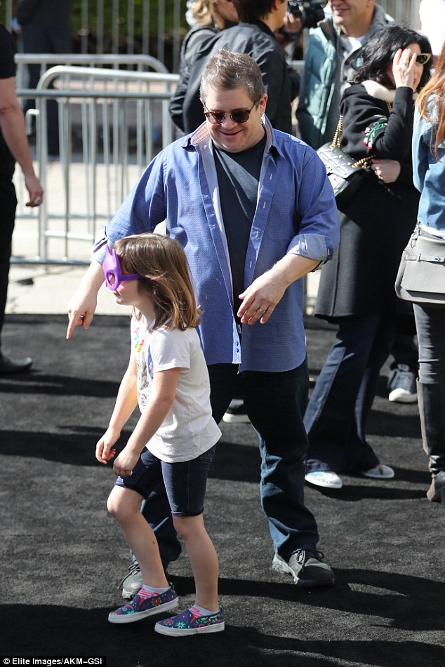 Getting into the spirit of things: The seven-year-old wore a purple mask resembling the one the title character of the movie wears