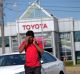 A Toyota worker shares the news on Tuesday afternoon. 