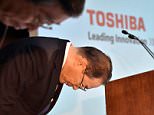 Shame: Toshiba president Masashi Muromachi bows his head as he announces new management  following the billion dollar accounting scandal