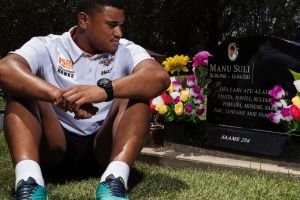 SYDNEY, AUSTRALIA - JANUARY 28: Wests Tigers player Moses Suli visiting his fathers grave at Rookwood Cemetary on ...