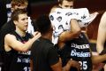 Breakers players applaud Akil Mitchell as he is helped off the court after suffering a serious eye injury on Thursday night.