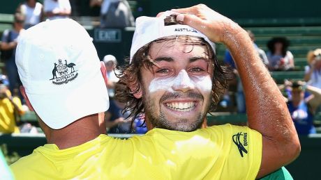 Jordan Thompson of Australia is congratulated after winning the tie against the Czech Republic.