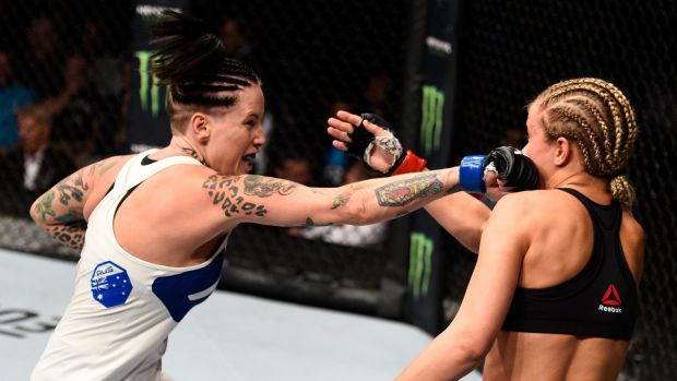 Bec Rawlings of Australia punches Paige VanZant of the United States.