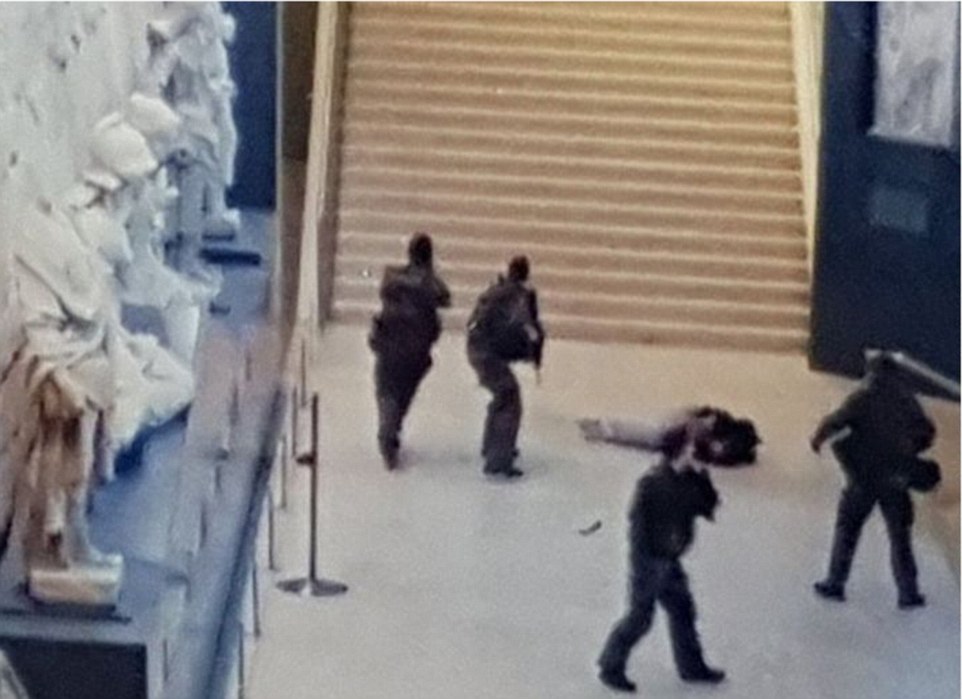 A grainy picture claims to show the immediate aftermath of this morning's shooting, after a machete-wielding man attacked four soldiers outside the Louvre, which houses many of the world's most famous paintings, including the Mona Lisa