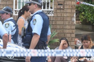 Police at the house in Fairfield West, where toddler Henry Tran fell into a fish pond.