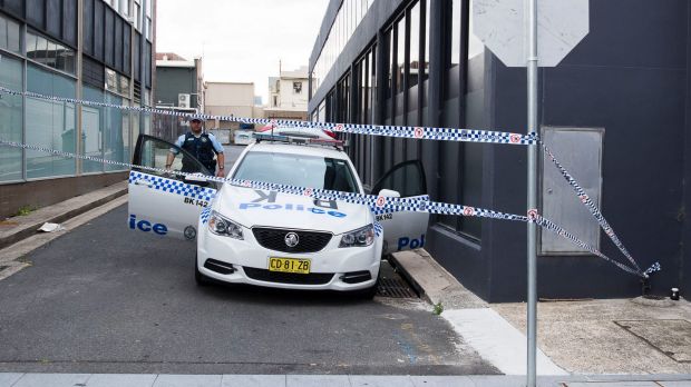 Police guard the laneway where the two boys were arrested in October.