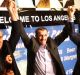 Ali Vayeghan, an Iranian citizen with a valid US visa, lifts his arms with his brother Houssein and Los Angeles mayor ...