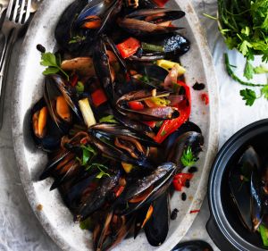 Kylie Kwong's stir-fried mussels with black beans, chilli and native herbs.