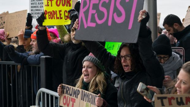 Protesters assemble at John F Kennedy International Airport in New York last week.