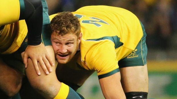 Former Wallaby and returning Red Scott Higginbotham has been charged with threatening police.