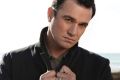 Singer Shannon Noll was arrested outside an Adelaide strip club.