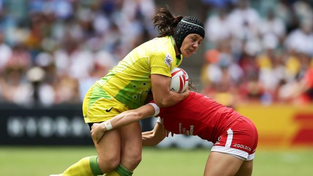 Adversity: Sharni Williams is tackled during the semi-final match between Australia and Canada.