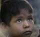 A family who fled violence in Salipara village in Myanmar, sit by a fire in the Balu Kali Rohingya refugee camp in Cox's ...