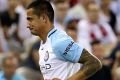 Tim Cahill heads off Etihad Stadium after being red-carded by Chris Beath.