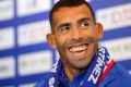 Argentine striker Carlos Tevez attends his first presser after joining Shanghai Shenhua in Shanghai on January 21.