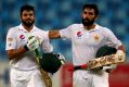 Triple treat: Azhar Ali (left) is congratulated by Misbah-ul-Haq after scoring a triple century against the West Indies ...
