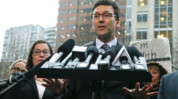 Washington Attorney General Bob Ferguson talks to reporters following the judge's order on Friday.